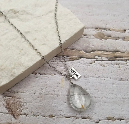 Wish Dandelion necklace by Ivy's Gifts & Boutique featuring a delicate dandelion charm on a silver chain.