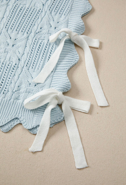 Light blue summer sweater with side tie accents, by Ivy's Gifts & Boutique, featuring a relaxed fit and casual style.