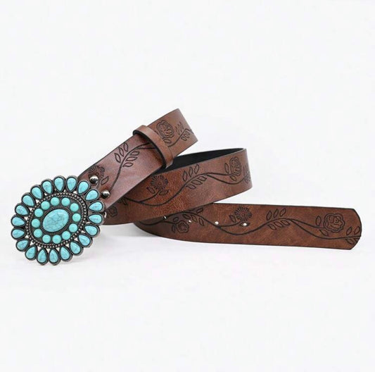 Faux turquoise Western-style belt from Ivy's Gifts & Boutique featuring intricate stitching and a silver buckle.