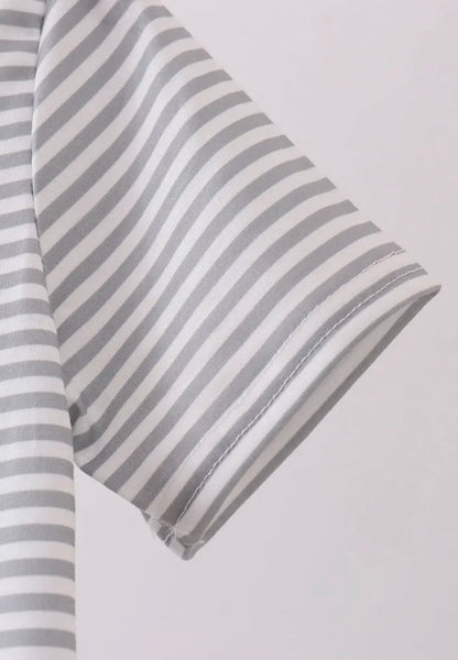 TN1 stripe polo shirt from Ivy's Gifts & Boutique featuring smokey embroidery and classic polo style in a close-up shot.
