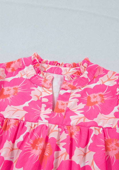 Pink and orange floral bubble sleeve summer top from Ivy's Gifts & Boutique featuring a short fit and vibrant floral print.