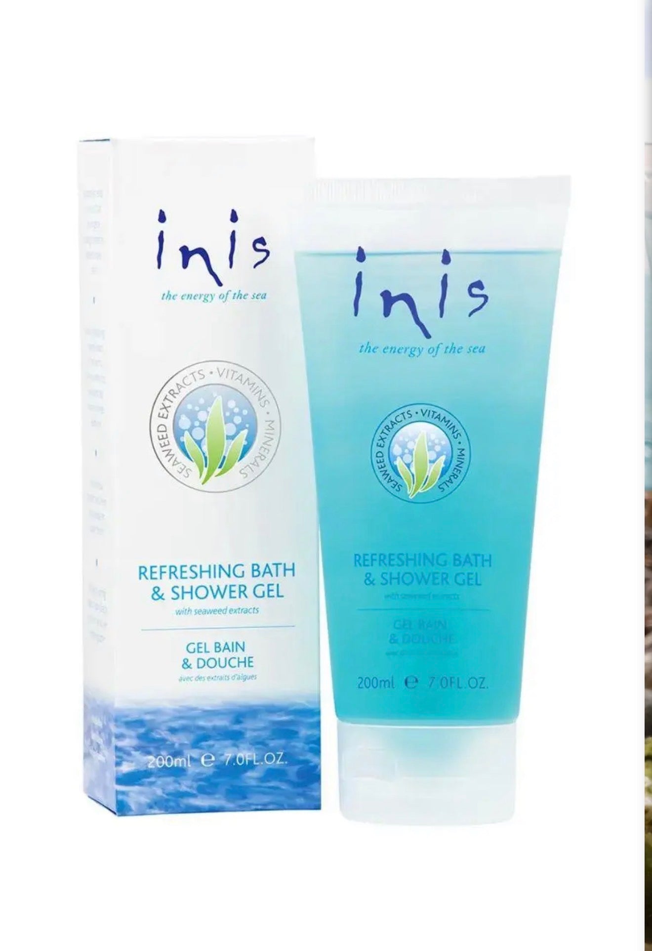 Inis bath and body products set with soap, lotion, and skincare items arranged on a wooden surface, featuring elegant packaging.