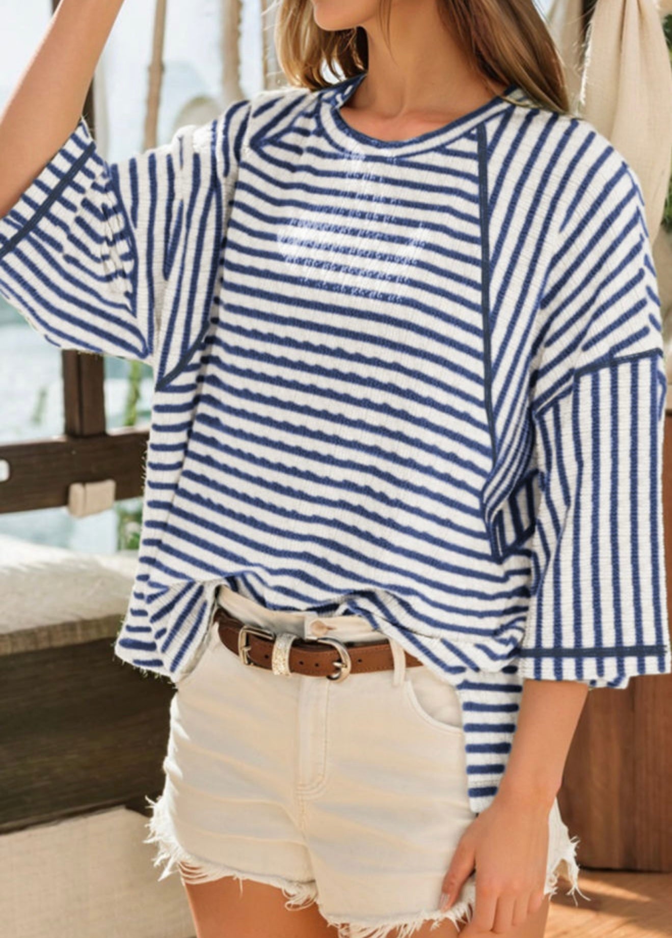 Blue and white striped half sleeve loose top by Ivy's Gifts & Boutique, showcasing a relaxed fit and casual style.