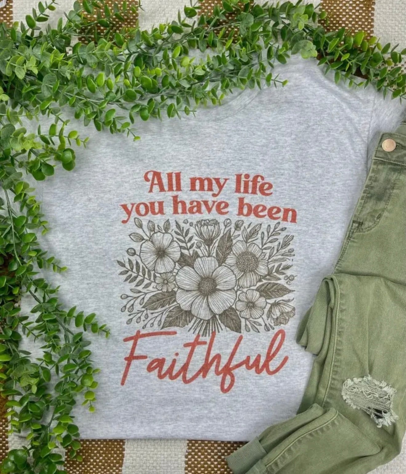 Close-up of the "All My Life You Have Been Faithful" decorative sign from Ivy's Gifts & Boutique, featuring elegant script on wood.