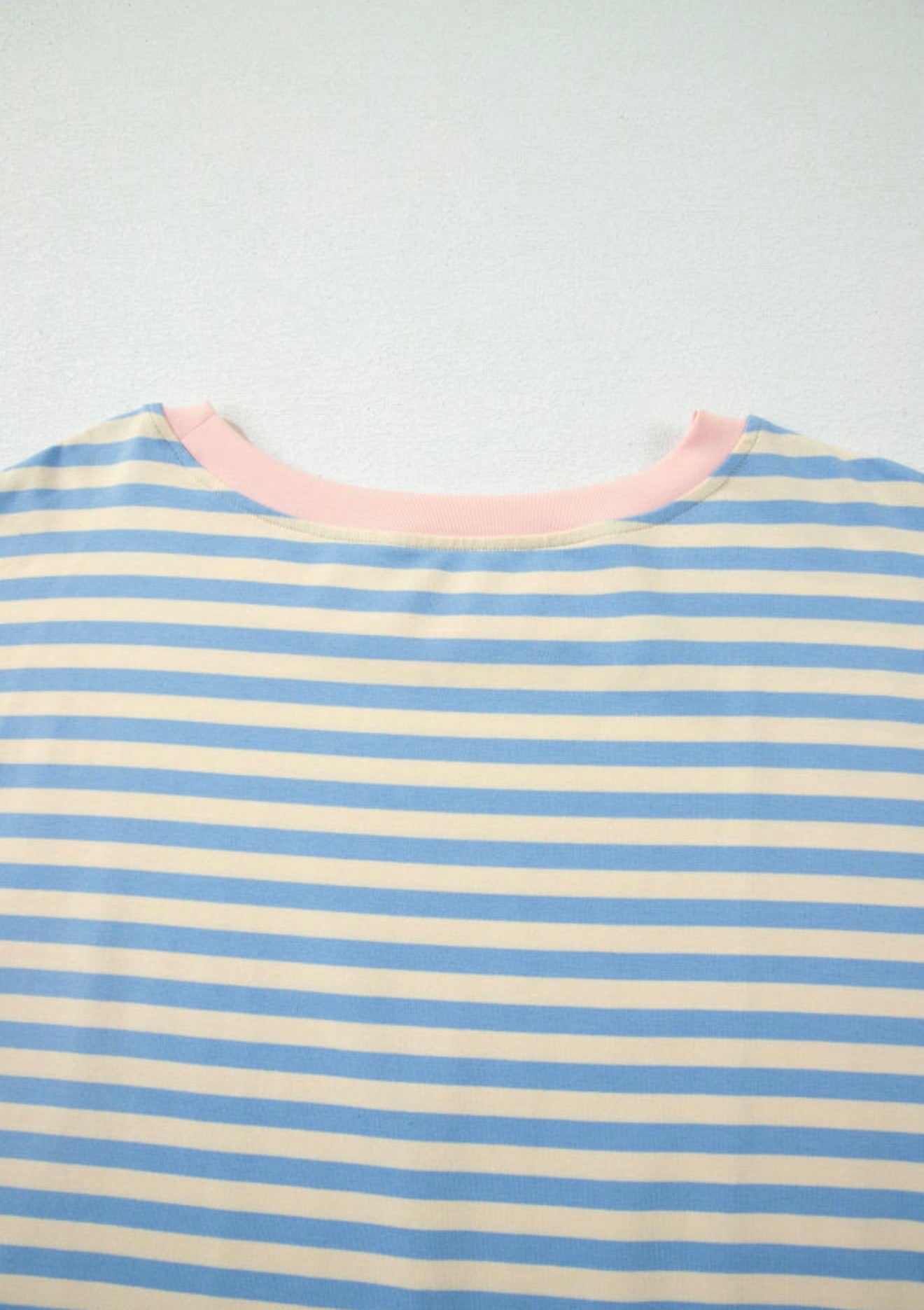 Sky blue drop shoulder stripe top with baby pink contrast trim around the neck from Ivy's Gifts & Boutique.