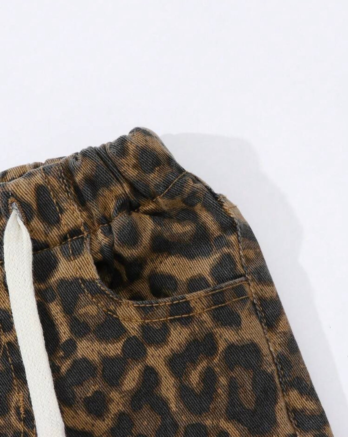 Ivy's Gifts & Boutique animal print jeans with elastic drawstring waist, front and back pockets, stylish and comfortable denim pants.