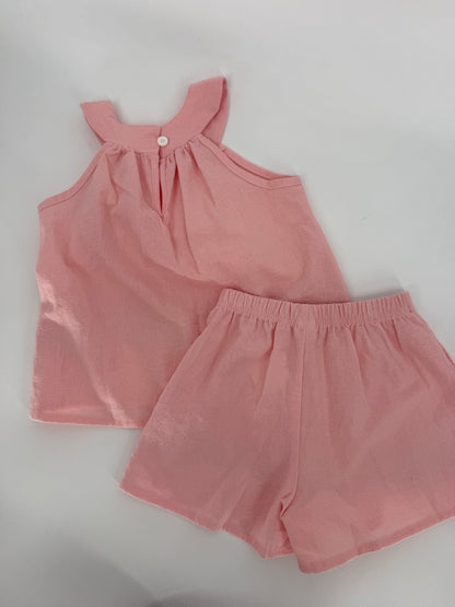 Pink crinkle fabric two-piece short set with red floral accents from Ivy's Gifts & Boutique, featuring a stylish, casual summer look.