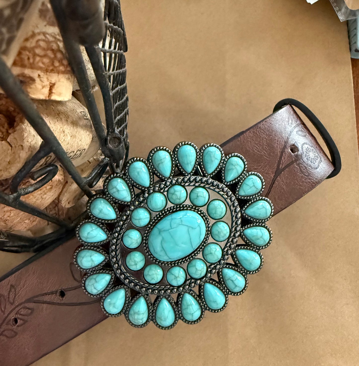 Faux turquoise belt from Ivy's Gifts & Boutique featuring a stylish turquoise-colored strap and silver-tone buckle detail.