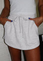 Light gray Ivy's Gifts & Boutique ML4 skort with drawstring waist and functional pockets, shown on a neutral background.