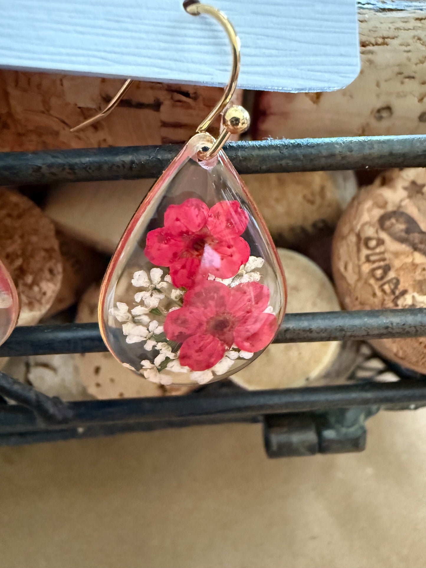Dried flower earrings with delicate floral design, handcrafted by Ivy's Gifts & Boutique, featuring natural flower accents and silver hooks.