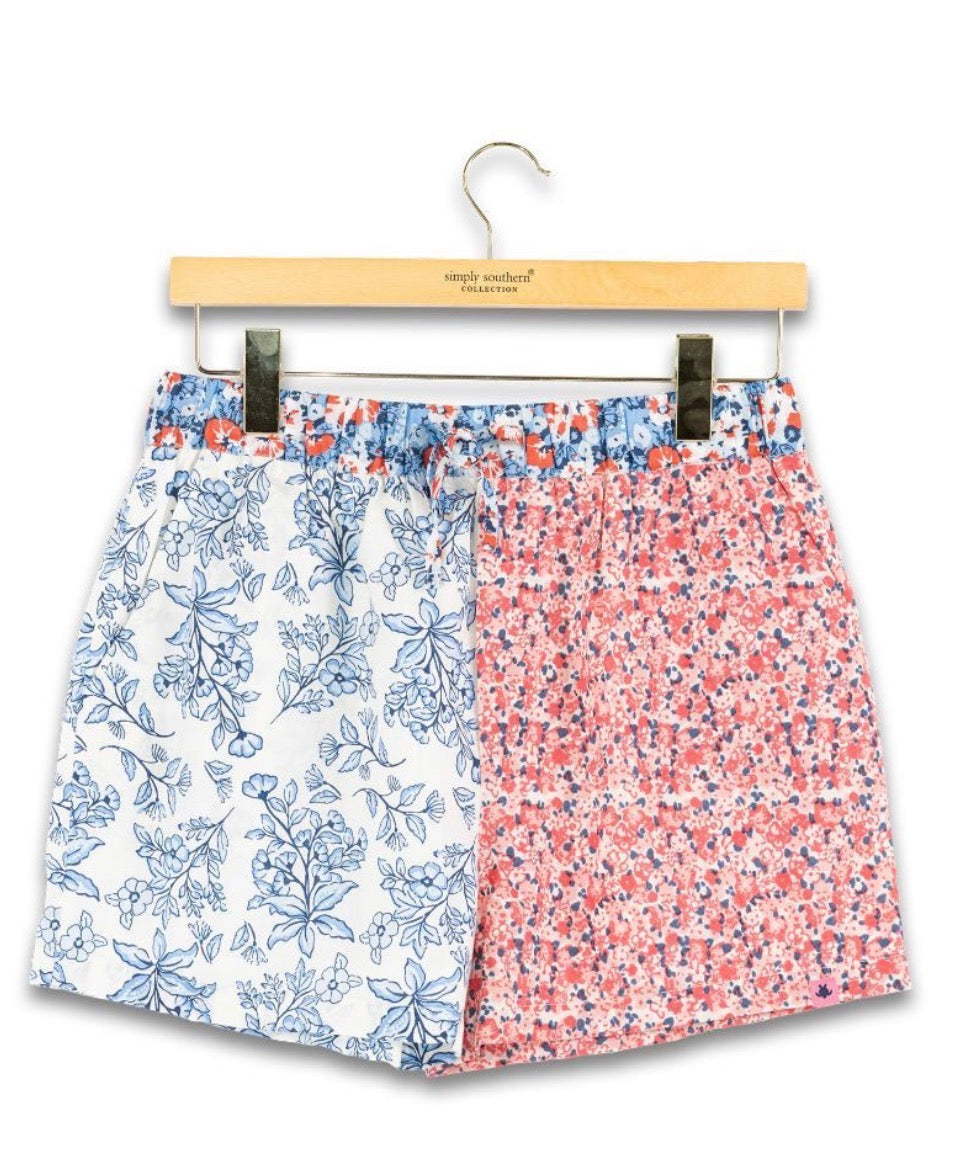 Red, white, and blue patchwork block style shorts from Ivy's Gifts & Boutique, showing a casual, colorful design with a comfortable fit.