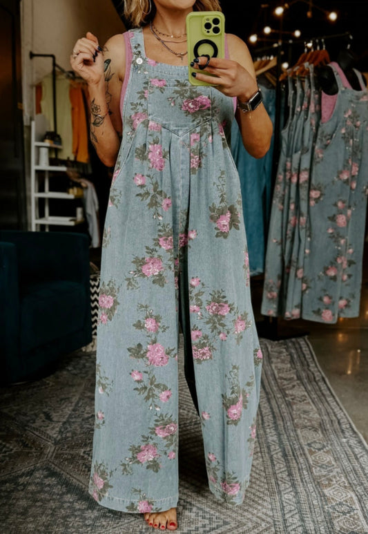 Floral print denim oversized overalls by Ivy's Gifts & Boutique, featuring a relaxed fit and vibrant floral design.