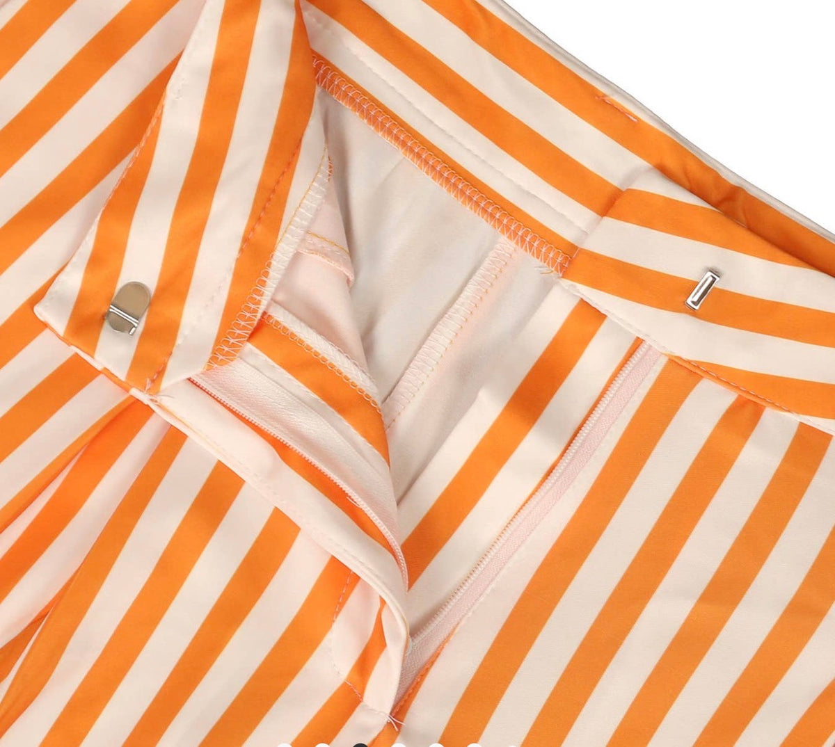 Orange and white striped wide leg pants by Ivy's Gifts & Boutique, featuring a relaxed fit and bold stripe pattern.