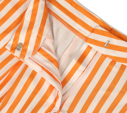 Orange and white striped wide leg pants by Ivy's Gifts & Boutique, featuring a relaxed fit and bold stripe pattern.
