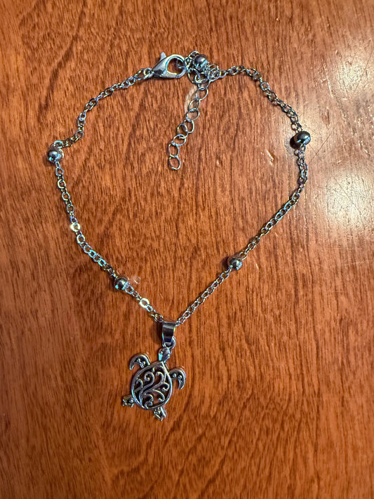 Sea turtle ankle bracelet by Ivy's Gifts & Boutique featuring a delicate charm on a thin, adjustable ankle chain.