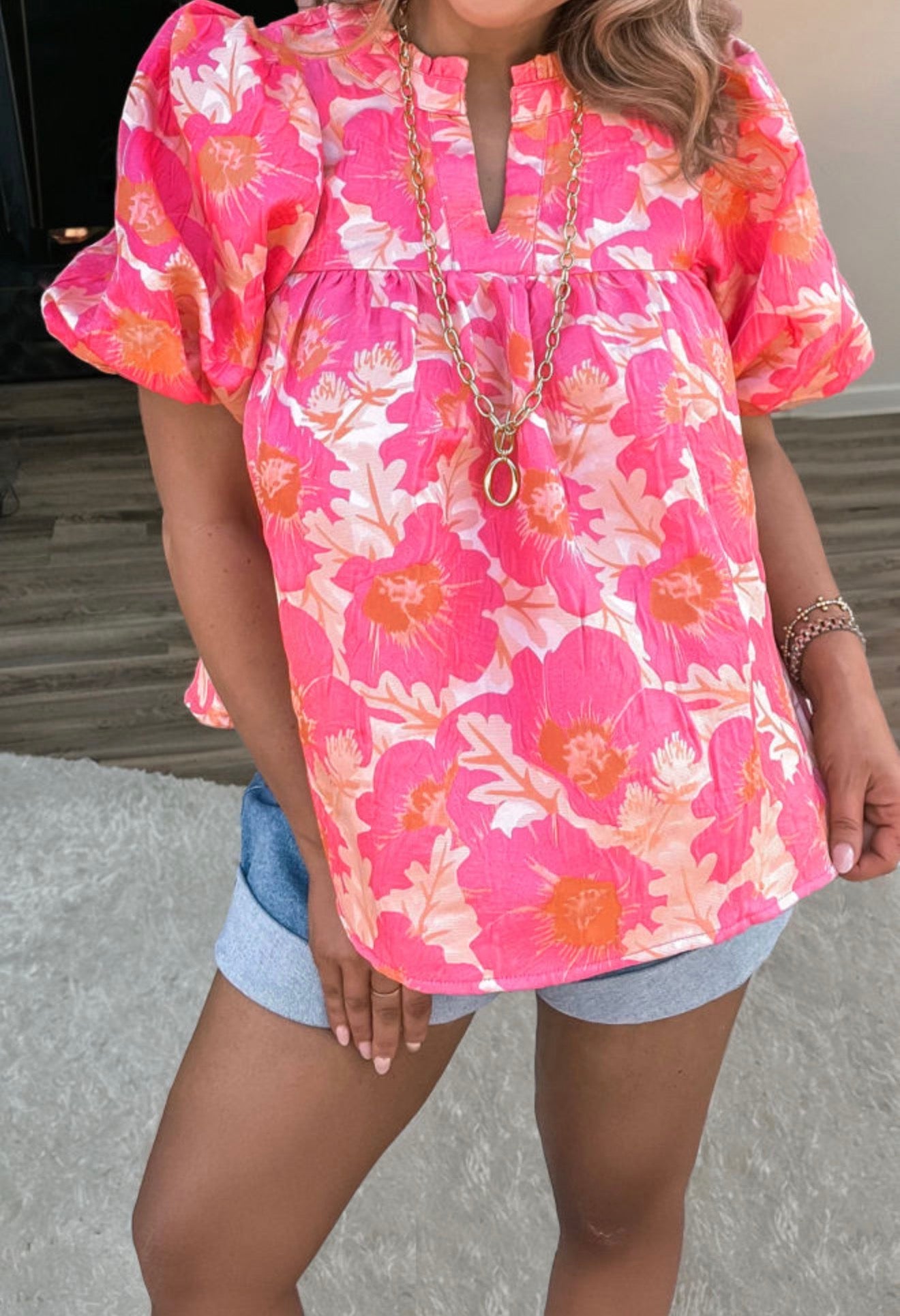 Pink and orange floral short summer top with bubble sleeves, from Ivy's Gifts & Boutique, featuring a lightweight, breezy design.