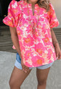 Pink and orange floral short summer top with bubble sleeves, from Ivy's Gifts & Boutique, featuring a lightweight, breezy design.