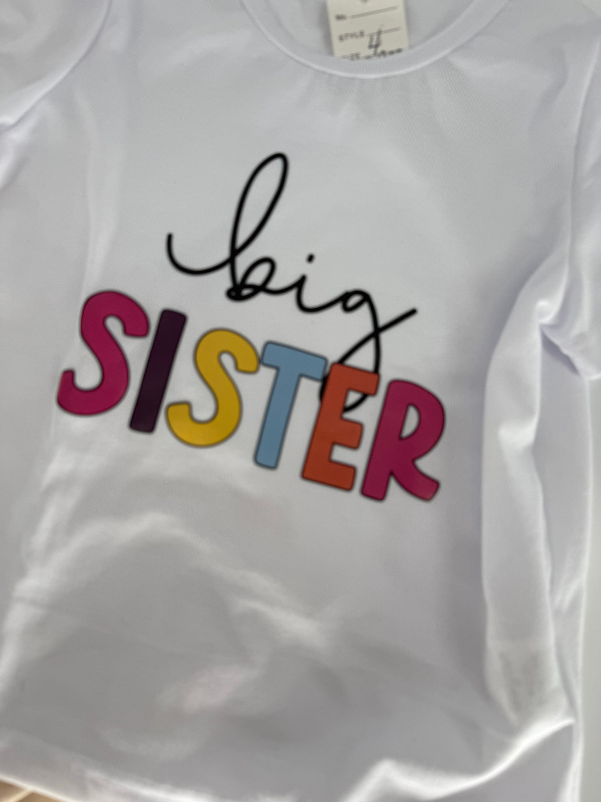 Big Sister T-shirt from Ivy's Gifts & Boutique featuring playful lettering and a comfortable cotton fabric design.