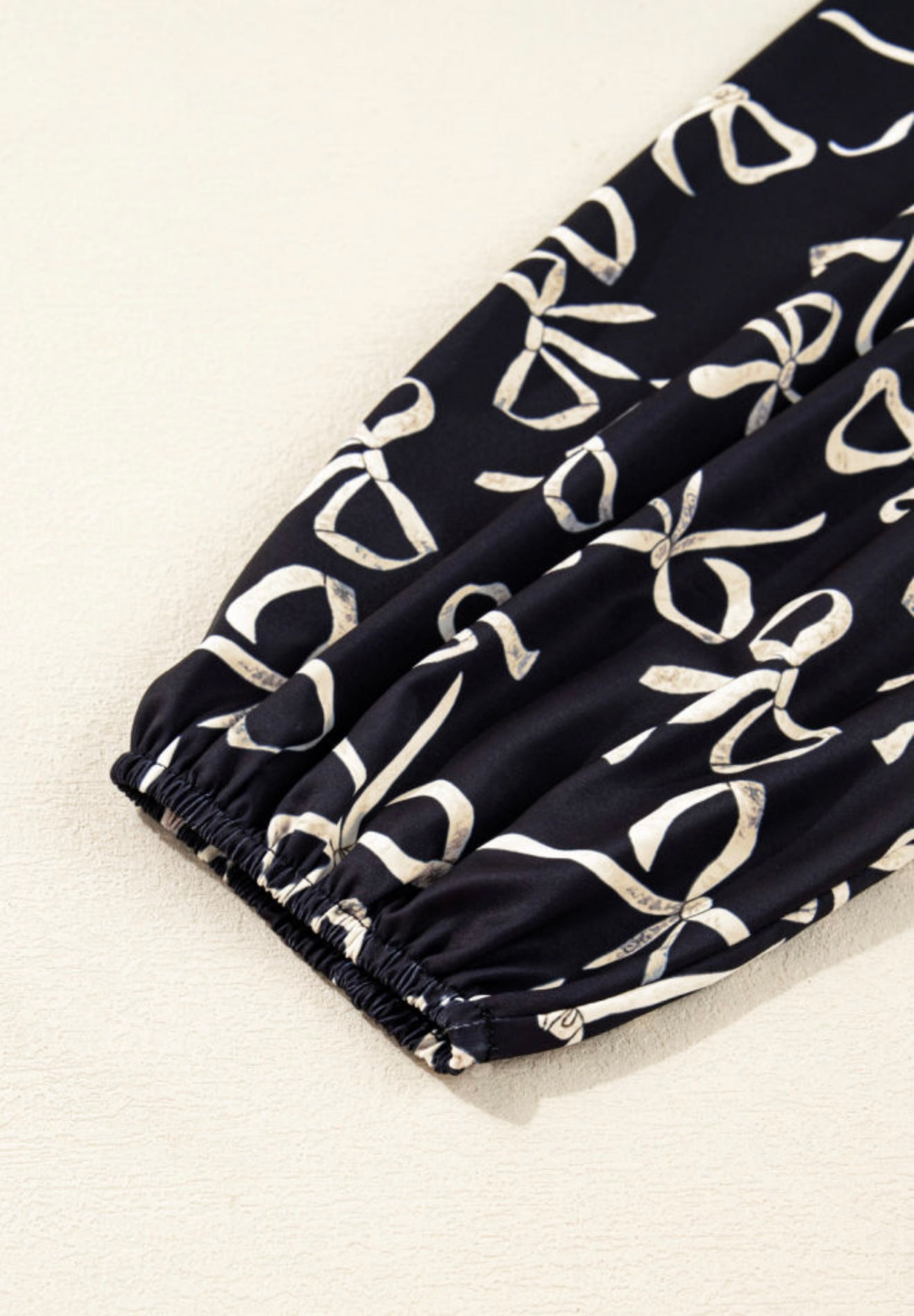 A44 Black Top with Bow Accent Long Puff Sleeve - Ivy's Gifts & Boutique