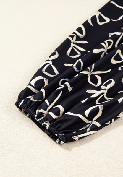 A44 Black Top with Bow Accent Long Puff Sleeve - Ivy's Gifts & Boutique