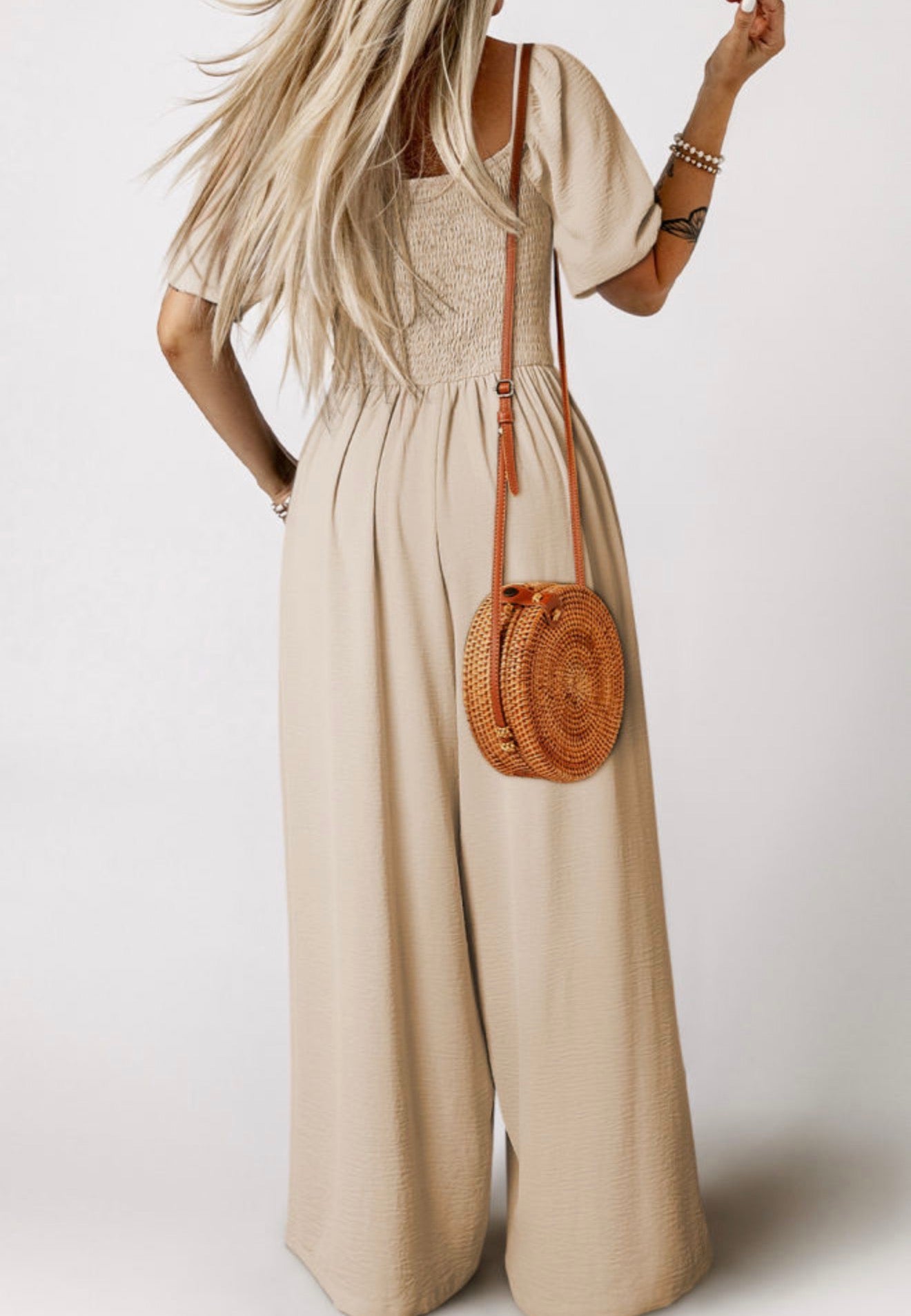 Ivy's Gifts & Boutique ML11 wide leg jumpsuit with puff sleeves and elastic bodice, shown in a stylish, fitted design.