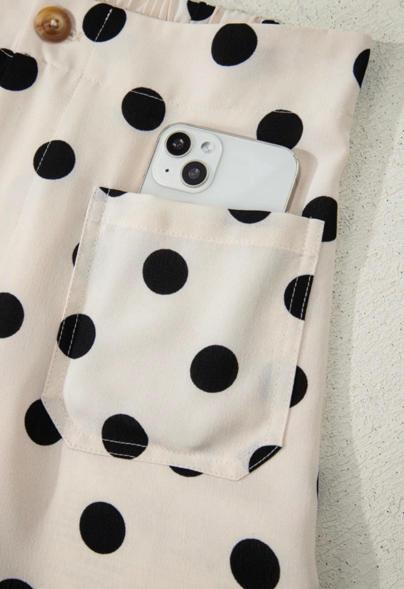 Black polka dot cream pants with back and side pockets from Ivy's Gifts & Boutique, stylish and comfortable for casual wear.