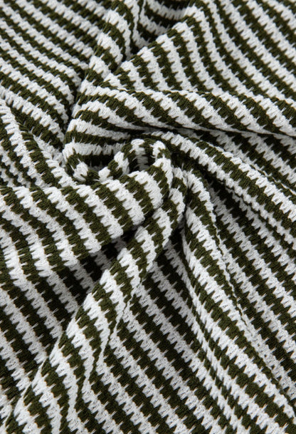Green and white striped textured notched V-neck short sleeve top by Ivy's Gifts & Boutique, shown on a mannequin.