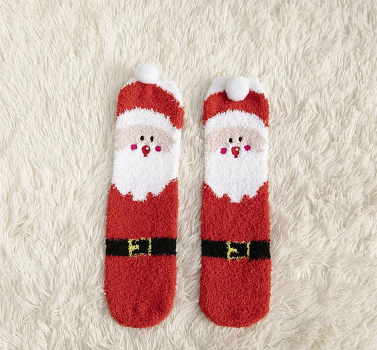 Ivy's Gifts & Boutique holiday socks with pom pom accents, featuring festive red and green patterns and cozy knit texture.