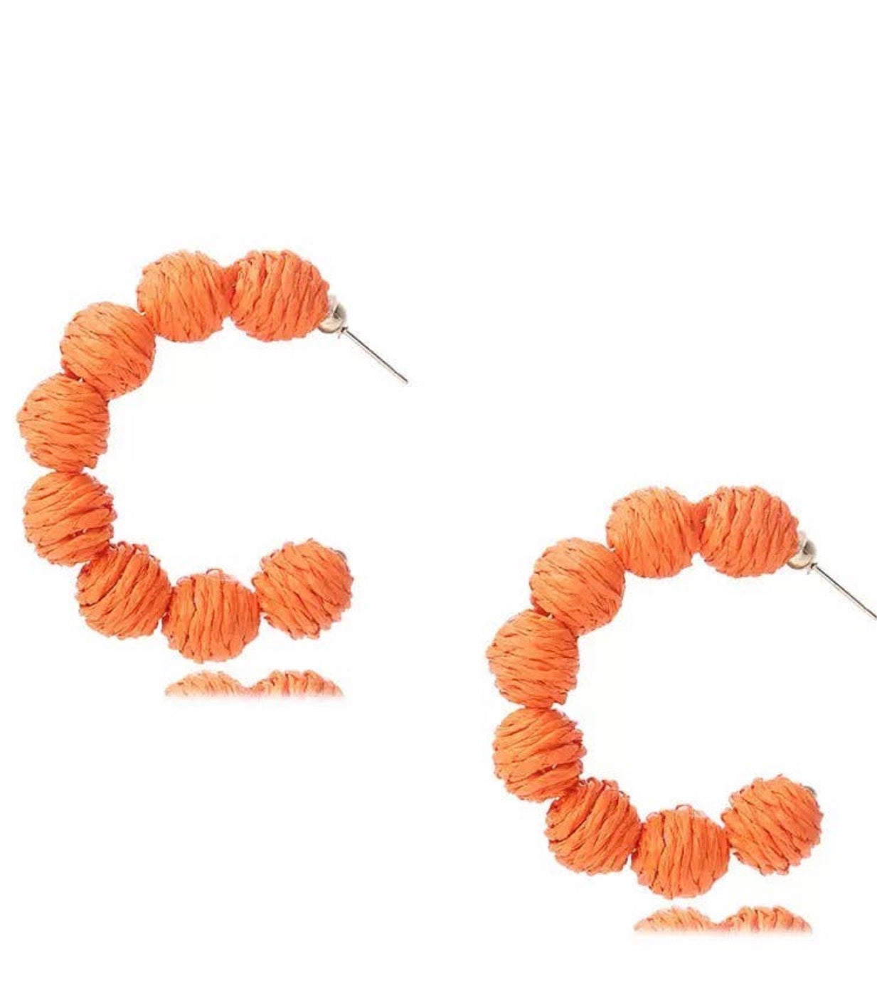 Orange rattan woven earrings with hoop design from Ivy's Gifts & Boutique, featuring a lightweight, bohemian style.