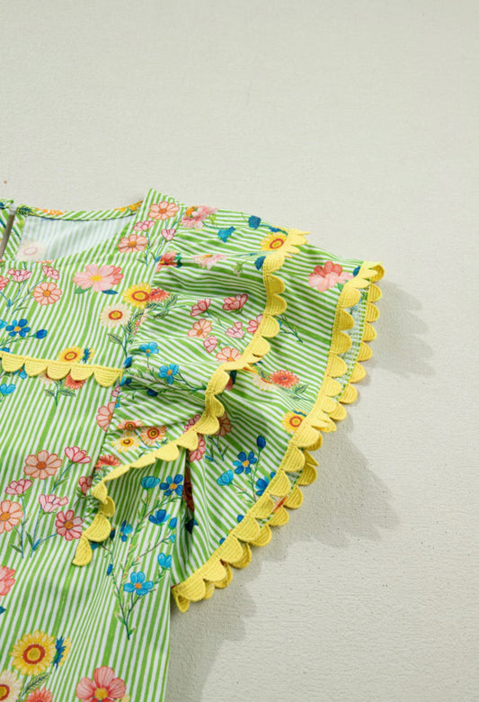 Green floral print summer top with ruffled cap sleeves and ric rac trim, by Ivy's Gifts & Boutique