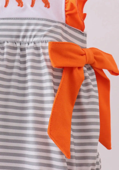 Baby girl TN5 orange and white romper by Ivy's Gifts & Boutique with gray stripe embroidery and side bows, on a white background.
