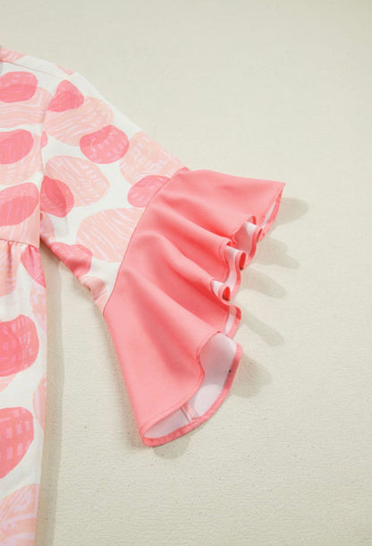Pink ruffle hem sleeve button blouse with oversized polka dots from Ivy's Gifts & Boutique, loose fit and stylish design.