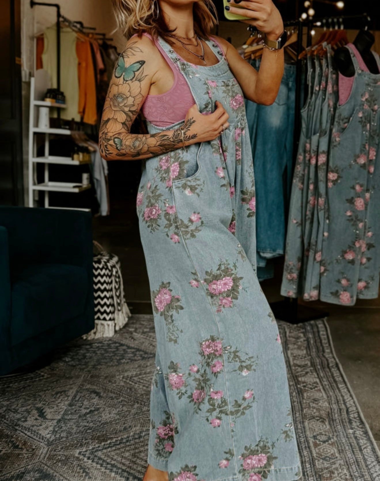 Floral print denim oversized overalls from Ivy's Gifts & Boutique, featuring a relaxed fit and adjustable straps.