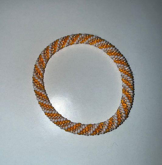 Rob Aid Through Trade Roll-On Bracelets by Ivy's Gifts & Boutique, featuring colorful, adjustable bracelets designed for everyday wear.