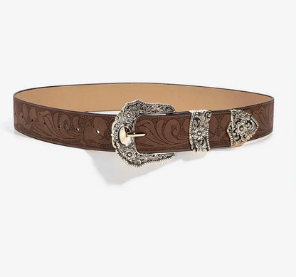 Western style embossed leather belt with silver buckle accents, featuring detailed embossing and sturdy construction from Ivy's Gifts & Boutique.