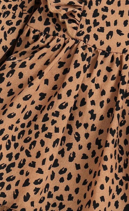 Animal print long sleeve dress by Ivy's Gifts & Boutique with ruffle details on shoulders and hem, stylish and comfortable for any occasion.