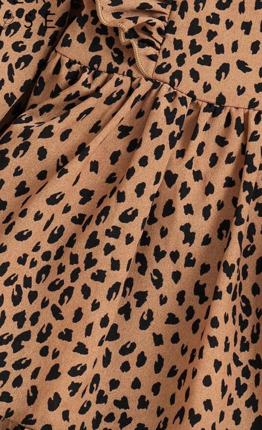 Animal print long sleeve dress by Ivy's Gifts & Boutique with ruffle details on shoulders and hem, stylish and comfortable for any occasion.