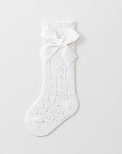 Baby knee socks with bow detail from Ivy's Gifts & Boutique, featuring soft fabric and adorable bow accents for infants.