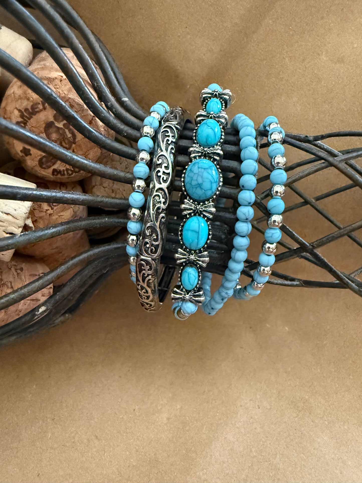 Set of five Ivy's Gifts & Boutique J19 faux turquoise stretch bracelets with beaded design on elastic cords.