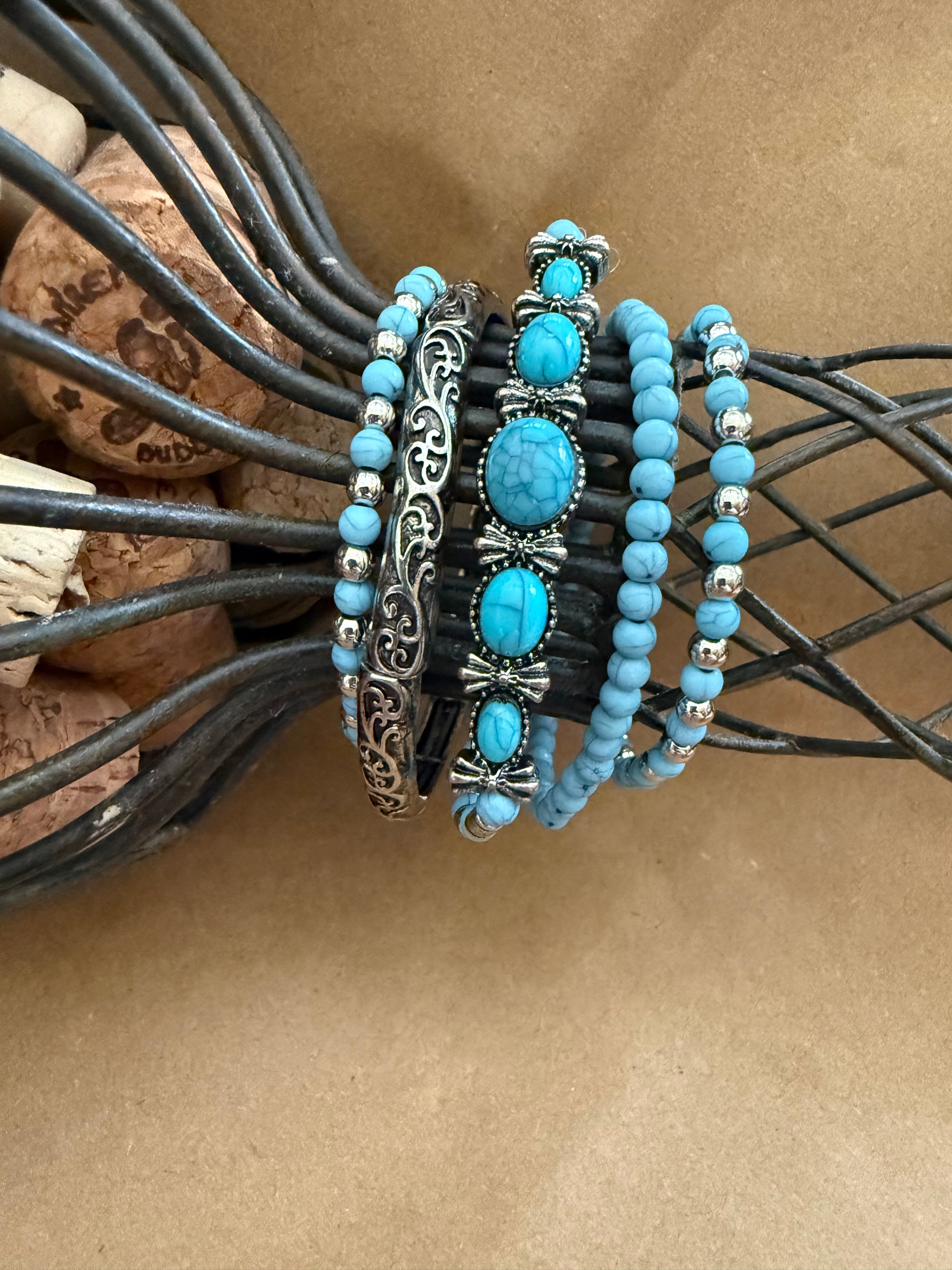 Set of five Ivy's Gifts & Boutique J19 faux turquoise stretch bracelets with beaded design on elastic cords.