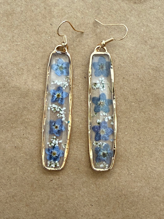 Blue and white dried flower drop earring from Ivy's Gifts & Boutique, 2.25 inches in length, featuring floral design and elegant style.