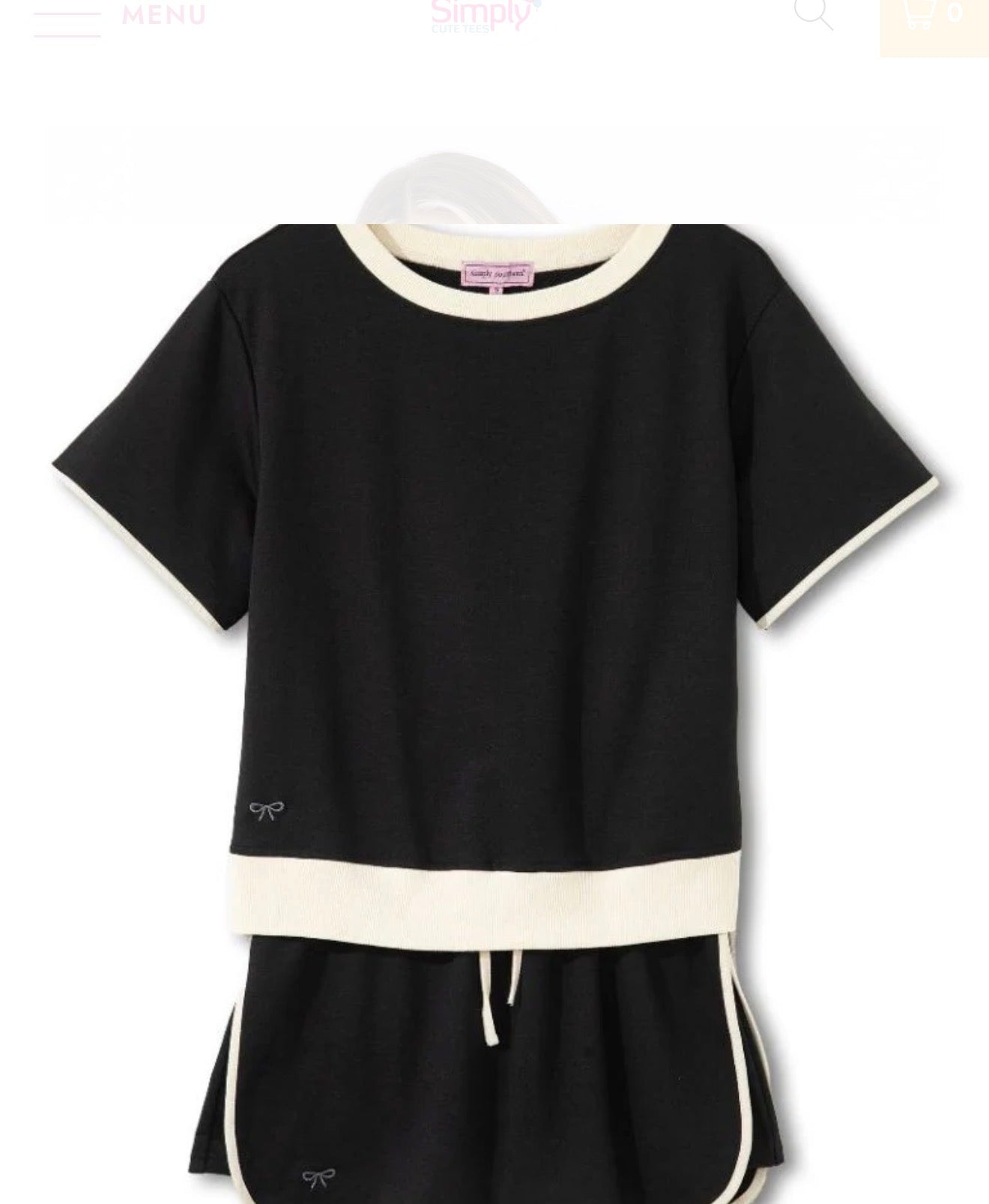 Black and ivory trimmed two-piece skort set by Ivy's Gifts & Boutique, featuring a stylish skirt and matching top.
