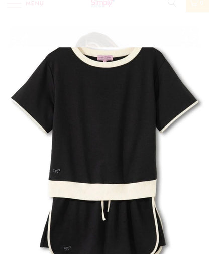 Black and ivory trimmed two-piece skort set by Ivy's Gifts & Boutique, featuring a stylish skirt and matching top.