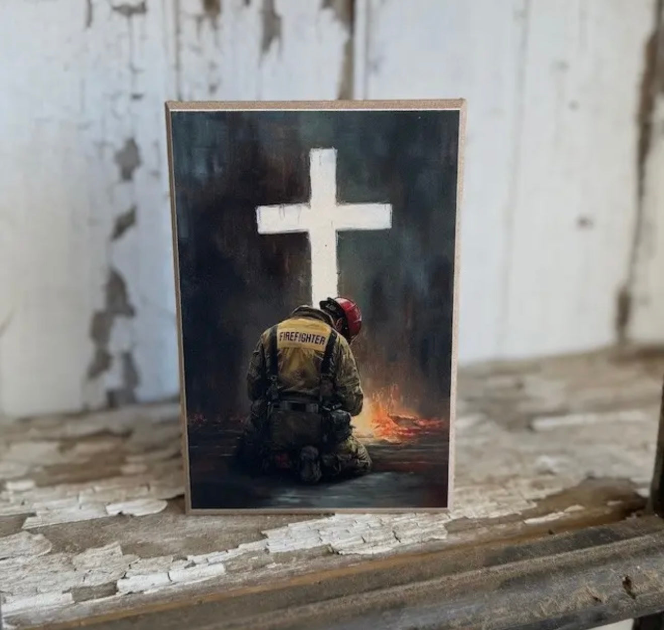 Fire Fighter Kneeling At The Foot Of The Cross Sign