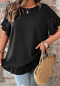 Black ruffle petal sleeve and hem top with tie back closure from Ivy's Gifts & Boutique, shown on a model.
