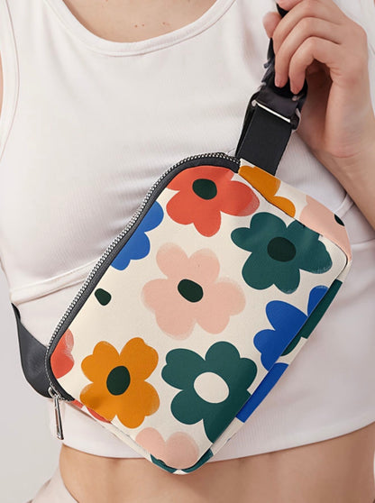 Cute flower printed vinyl cross body fanny pack by Ivy's Gifts & Boutique, featuring colorful floral design and adjustable strap