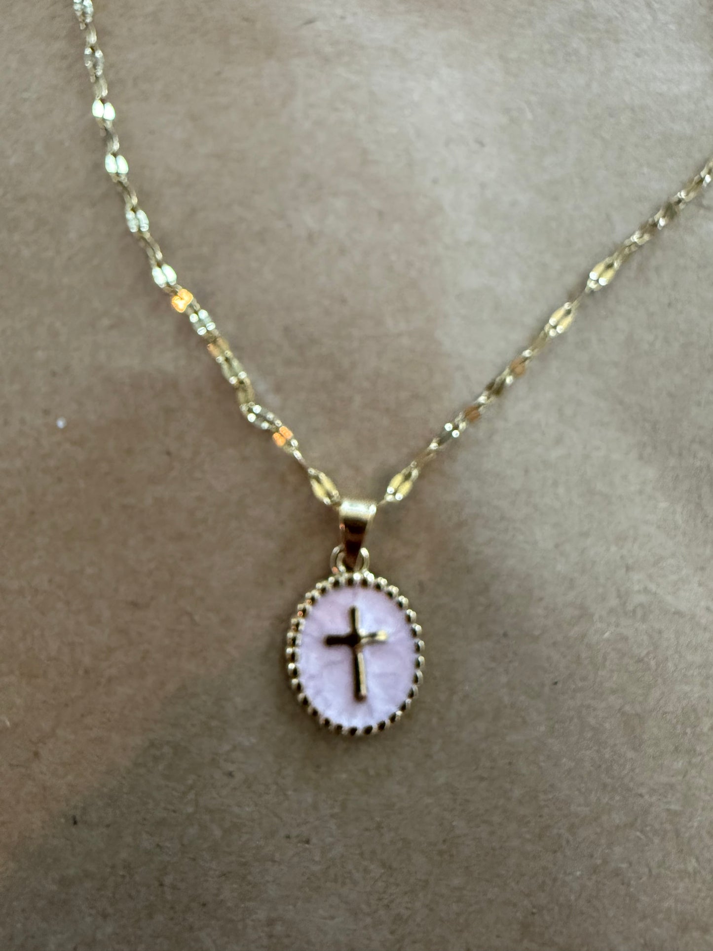 Enamel cross necklace from Ivy's Gifts & Boutique featuring a colorful religious pendant on a chain.