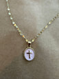 Enamel cross necklace from Ivy's Gifts & Boutique featuring a colorful religious pendant on a chain.