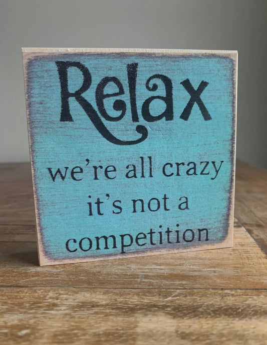 Relax we’re all crazy…block sign