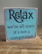 Relax we’re all crazy…block sign